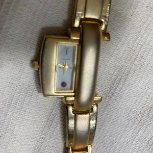 Woman's Gold Bracelet Watch with Hidden Face Dial